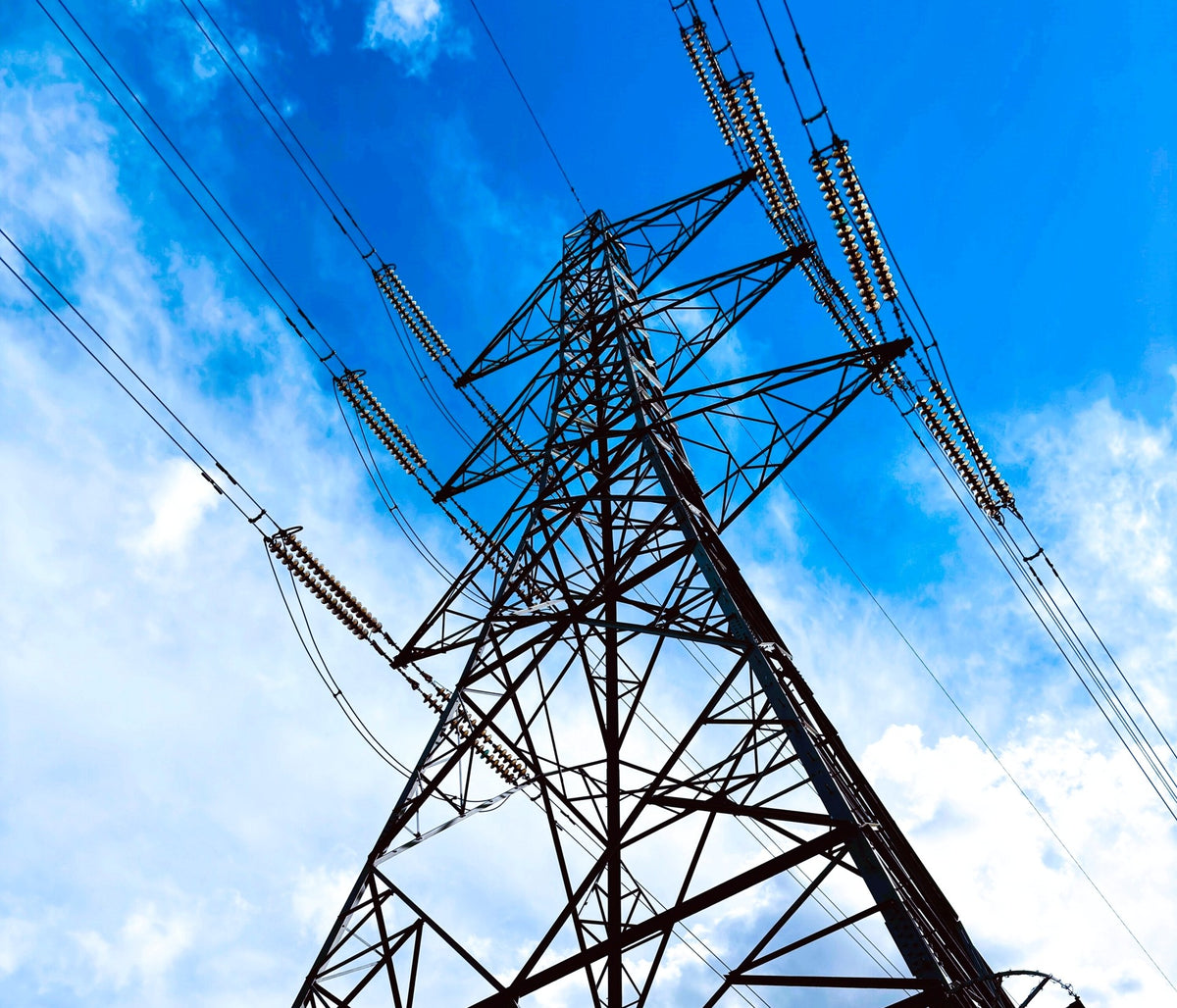 Electrical transmission towers and power lines supporting electrical infrastructure